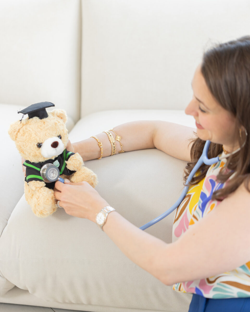 Dr. Farah Siam using stethoscope on teddy bear
